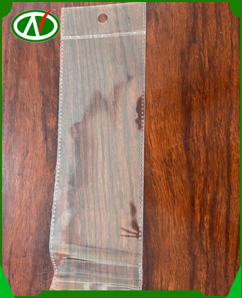 OPP bag with round hole hanging handle, serrated cut, with glue lid